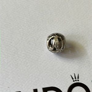 Pandora initial (A) charm